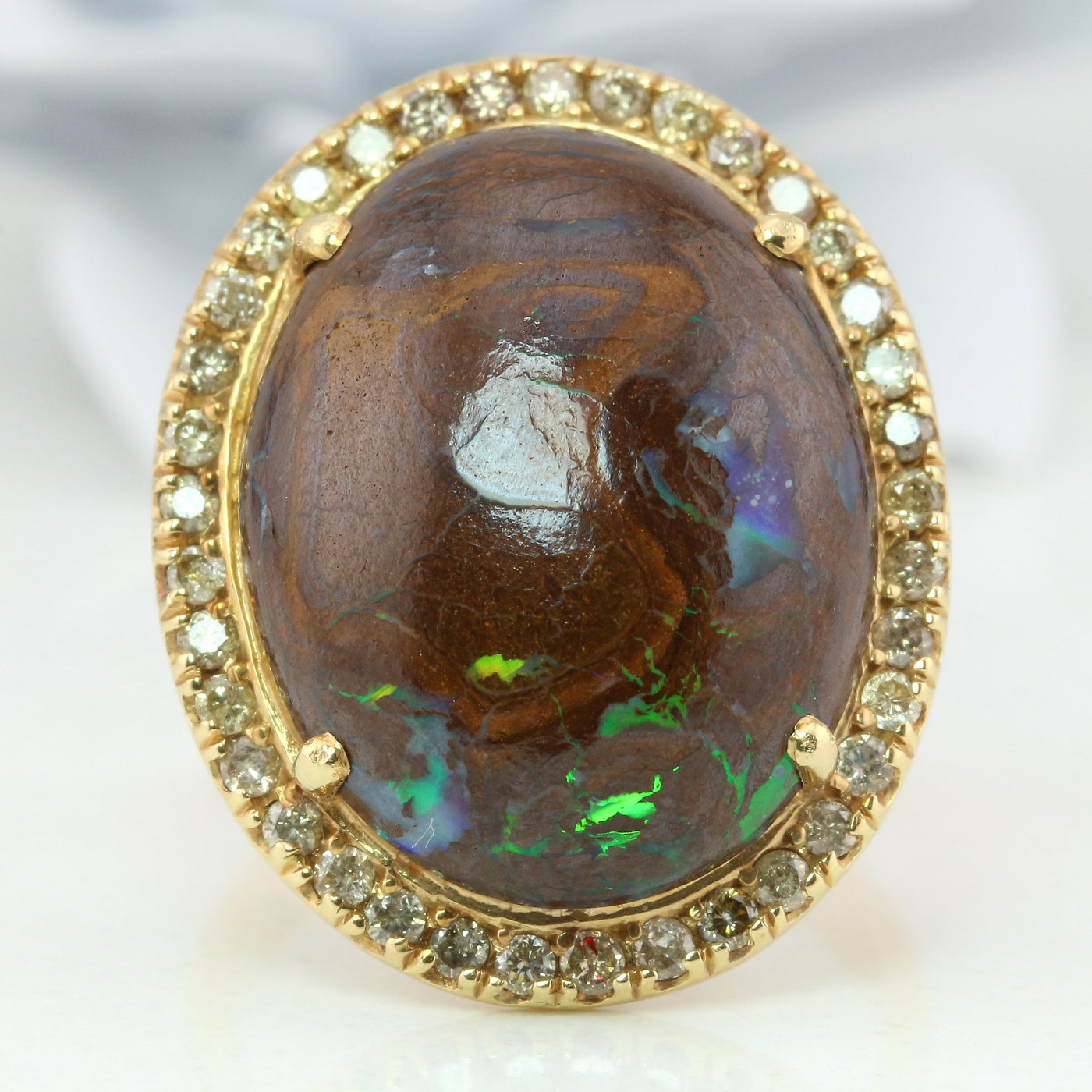 Boulder opal diamond halo ring