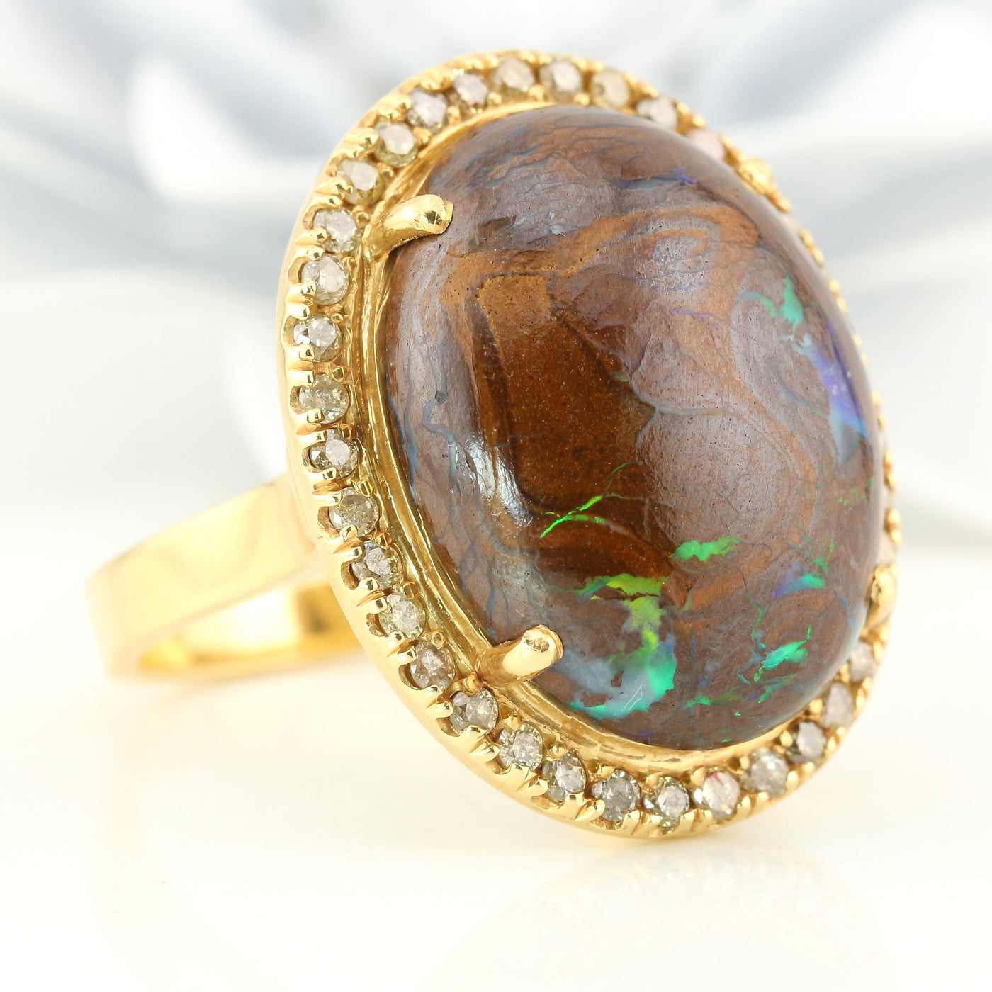 Boulder opal diamond halo ring